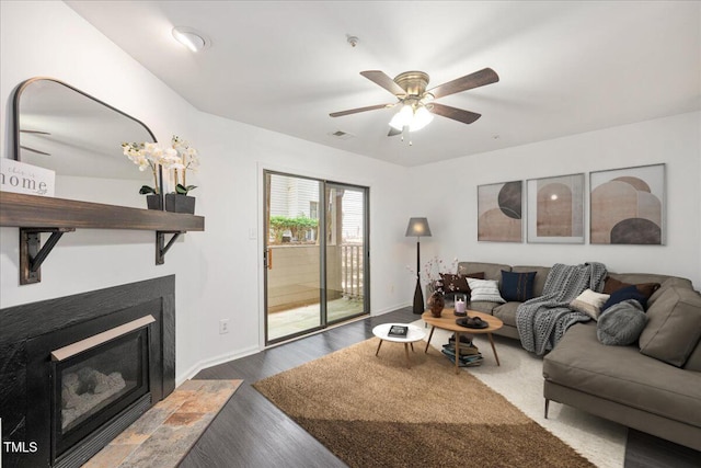 600 Audubon Lake Dr Unit 4B11, Durham, NC 27713 - living room featuring a ceiling fan, wood finished floors, and a glass covered fireplace