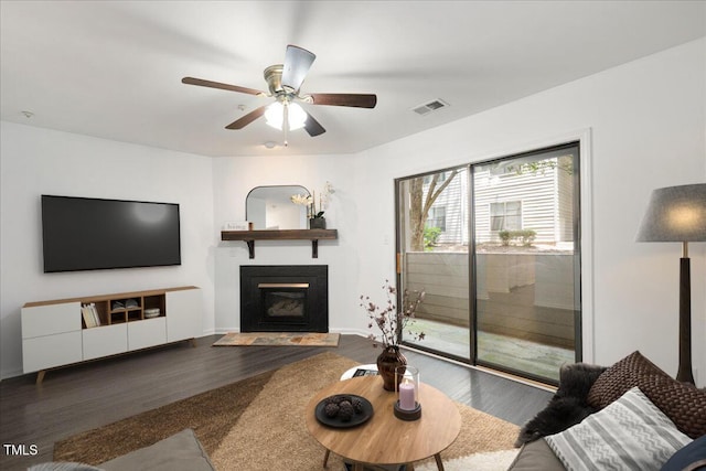 600 Audubon Lake Dr Unit 4B11, Durham, NC 27713 - living room featuring wood finished floors, a fireplace with flush hearth, and a ceiling fan