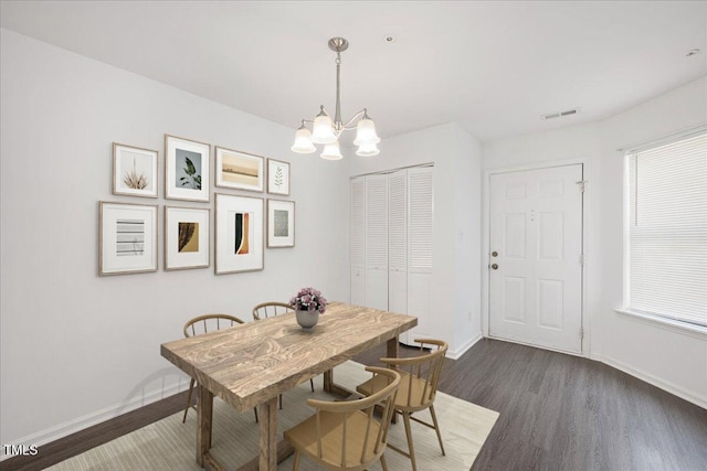 600 Audubon Lake Dr Unit 4B11, Durham, NC 27713 - dining room featuring dark wood finished floors and a chandelier