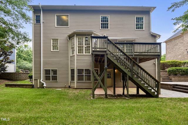 109 Aspenridge Dr, Holly Springs, NC 27540 - rear view of house with stairs, a wooden deck, a lawn, and a patio area