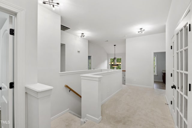 109 Aspenridge Dr, Holly Springs, NC 27540 - corridor featuring an upstairs landing, carpet flooring, and a chandelier