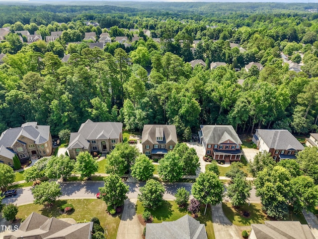 109 Aspenridge Dr, Holly Springs, NC 27540 - aerial perspective of suburban area with a heavily wooded area