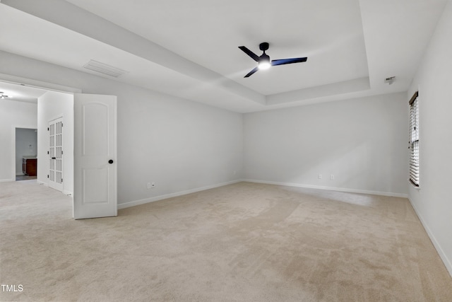 109 Aspenridge Dr, Holly Springs, NC 27540 - spare room with ceiling fan, carpet floors, and a raised ceiling