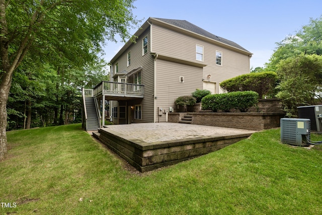 109 Aspenridge Dr, Holly Springs, NC 27540 - back of property with stairway, a deck, and a yard