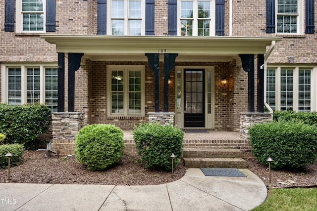 109 Aspenridge Dr, Holly Springs, NC 27540 - property entrance featuring brick siding and covered porch