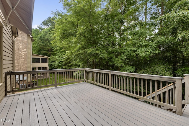 109 Aspenridge Dr, Holly Springs, NC 27540 - wooden deck featuring view of scattered trees