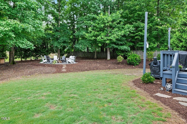 101 Ironcreek Pl, Apex, NC 27539 - view of yard featuring an outdoor fire pit and a wooden deck