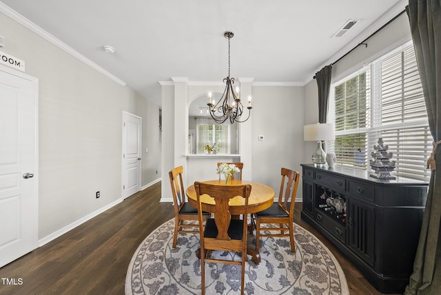 4413 Sugarbend Way, Raleigh, NC 27606 - dining area featuring dark wood-type flooring, a chandelier, plenty of natural light, and ornamental molding