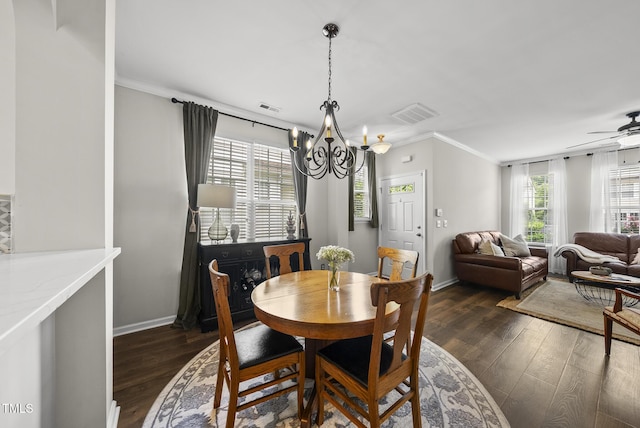 4413 Sugarbend Way, Raleigh, NC 27606 - dining room with dark wood-style flooring, a chandelier, ceiling fan, and ornamental molding