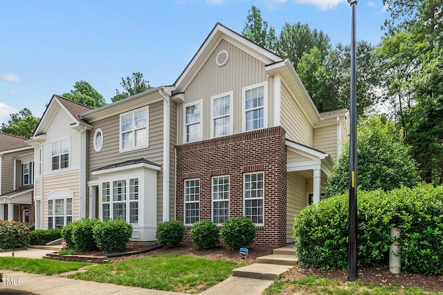 4413 Sugarbend Way, Raleigh, NC 27606 - view of front of house with brick siding and board and batten siding