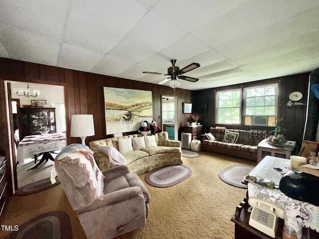 410 High St, Norlina, NC 27563 - carpeted living area with wooden walls, a chandelier, ceiling fan, a drop ceiling, and cooling unit