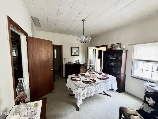 410 High St, Norlina, NC 27563 - dining space with carpet flooring and a chandelier