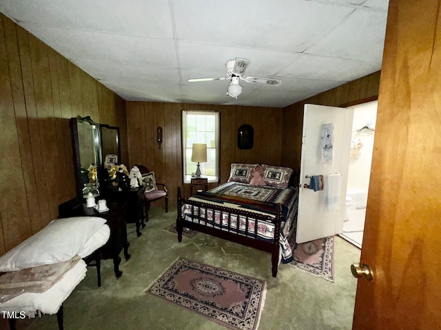410 High St, Norlina, NC 27563 - bedroom with carpet flooring, wooden walls, and a ceiling fan