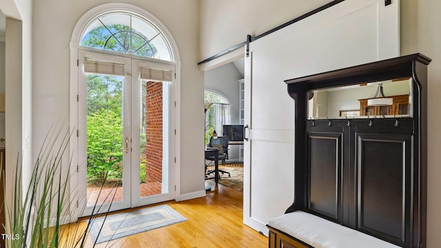 5 Wake Forest Ct, Southern Pines, NC 28387 - foyer entrance featuring a barn door, light wood-type flooring, and french doors