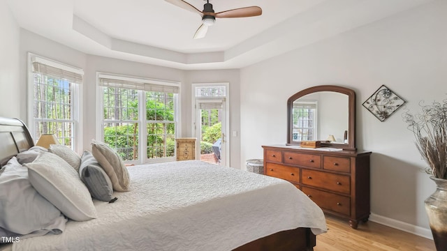 5 Wake Forest Ct, Southern Pines, NC 28387 - bedroom featuring access to exterior, light wood-style floors, multiple windows, and a ceiling fan