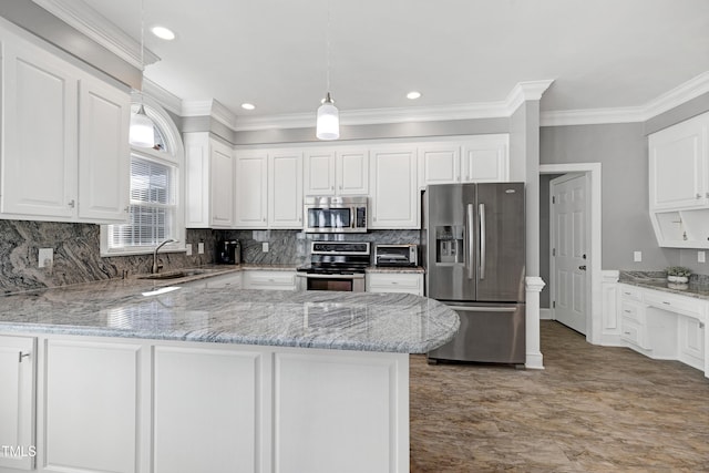 5013 Wheatridge Dr, Fuquay Varina, NC 27526 - kitchen with stainless steel appliances, crown molding, white cabinetry, light stone countertops, and a peninsula