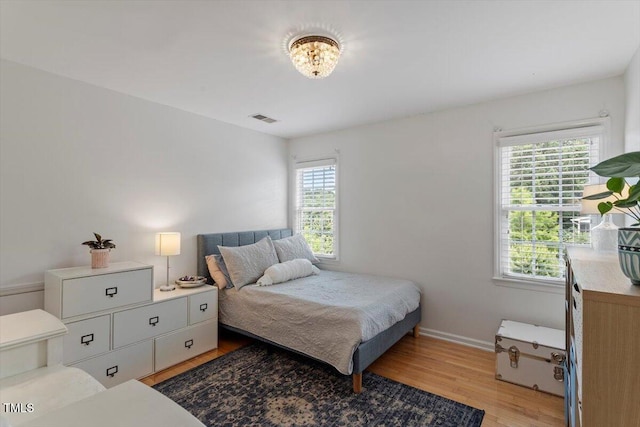 500 Weaver Mine Trl, Chapel Hill, NC 27517 - bedroom featuring light wood-style flooring and a chandelier