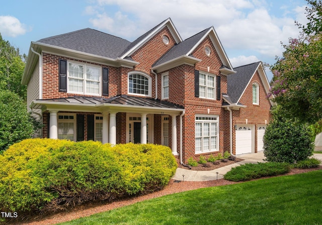 315 Birdwood Ct, Cary, NC 27519 - view of front of property featuring brick siding, driveway, a garage, a shingled roof, and covered porch