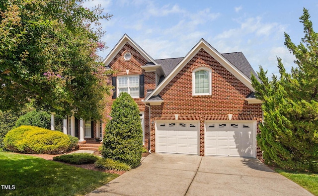 315 Birdwood Ct, Cary, NC 27519 - view of front facade with concrete driveway, brick siding, and a garage