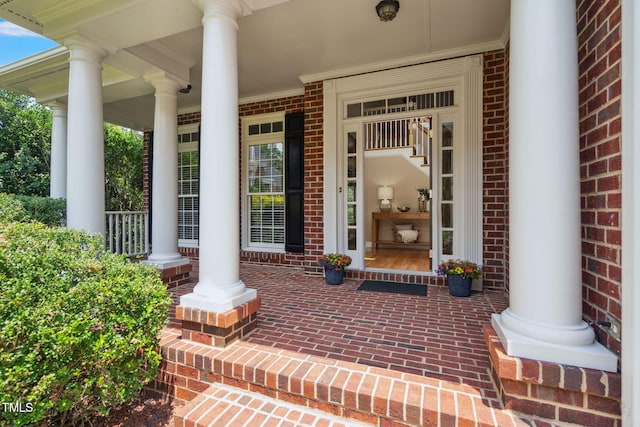315 Birdwood Ct, Cary, NC 27519 - property entrance with a porch and brick siding
