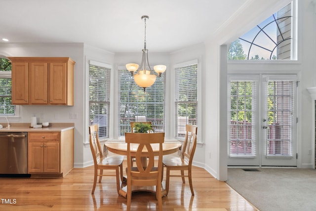 315 Birdwood Ct, Cary, NC 27519 - dining area featuring crown molding, light wood finished floors, and a chandelier