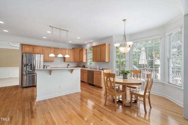 315 Birdwood Ct, Cary, NC 27519 - dining room with plenty of natural light, ornamental molding, light wood finished floors, recessed lighting, and a decorative wall