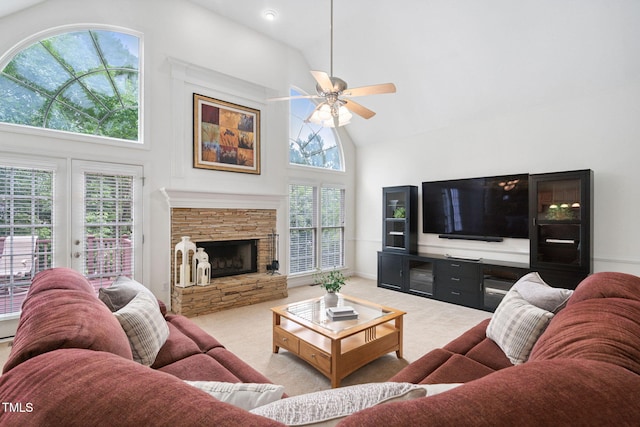 315 Birdwood Ct, Cary, NC 27519 - carpeted living area with high vaulted ceiling, a ceiling fan, and a fireplace