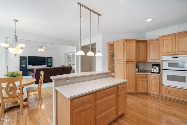 315 Birdwood Ct, Cary, NC 27519 - kitchen featuring light wood-type flooring, double oven, light countertops, crown molding, and recessed lighting