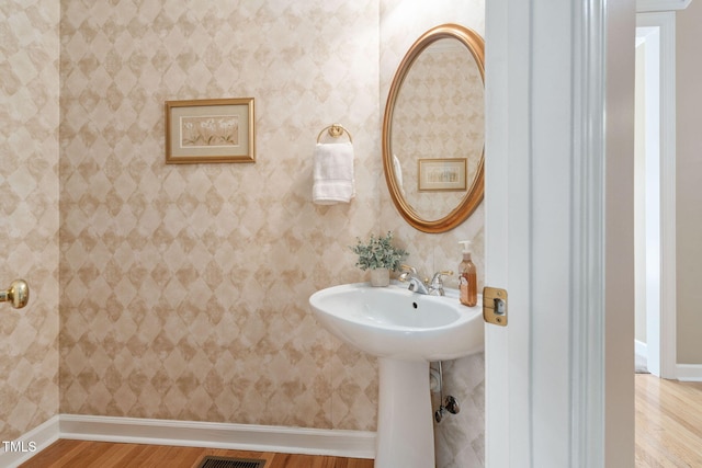 315 Birdwood Ct, Cary, NC 27519 - bathroom featuring wood finished floors and baseboards