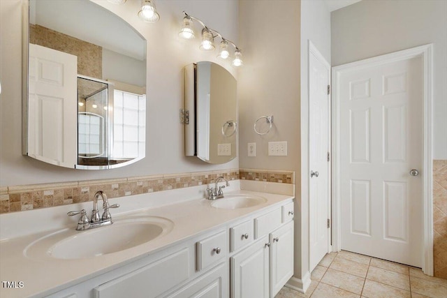 1016 Goldmist Ln, Durham, NC 27713 - full bathroom with tile patterned flooring, double vanity, and a shower