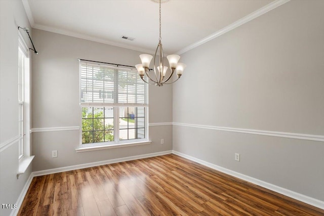 1016 Goldmist Ln, Durham, NC 27713 - spare room with a chandelier, plenty of natural light, wood finished floors, and crown molding
