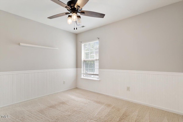 1016 Goldmist Ln, Durham, NC 27713 - carpeted spare room with a ceiling fan and wainscoting