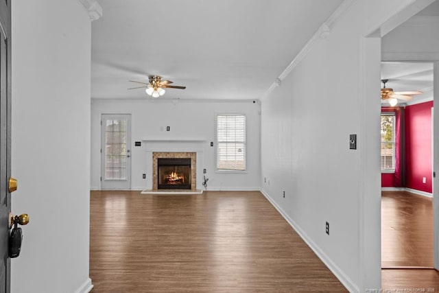 3118 High Plains Dr, Hope Mills, NC 28348 - unfurnished living room with a ceiling fan, wood finished floors, healthy amount of natural light, and crown molding
