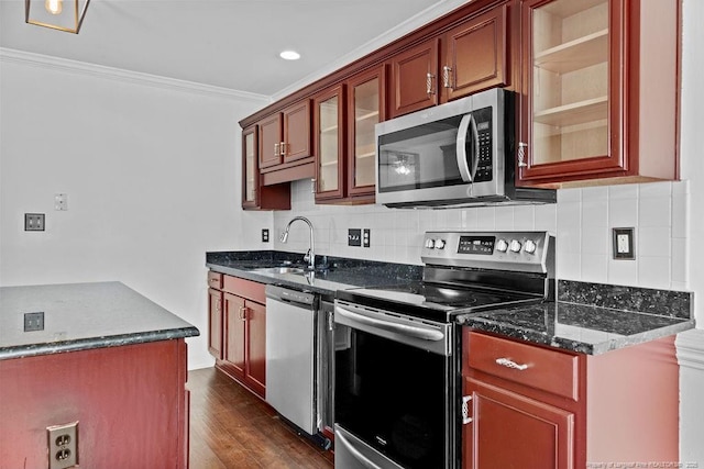 3118 High Plains Dr, Hope Mills, NC 28348 - kitchen featuring stainless steel appliances, ornamental molding, decorative backsplash, glass insert cabinets, and dark wood-style flooring