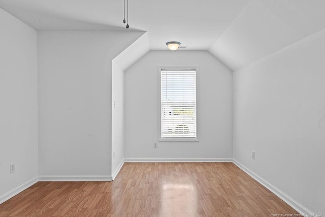 3118 High Plains Dr, Hope Mills, NC 28348 - bonus room with light wood-style floors and vaulted ceiling