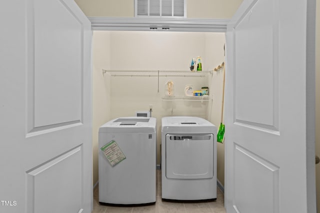 4124 Sykes St, Cary, NC 27519 - laundry area featuring separate washer and dryer and light tile patterned flooring