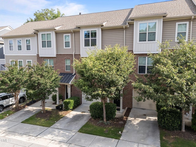 4124 Sykes St, Cary, NC 27519 - view of front facade featuring brick siding, driveway, an attached garage, and roof with shingles