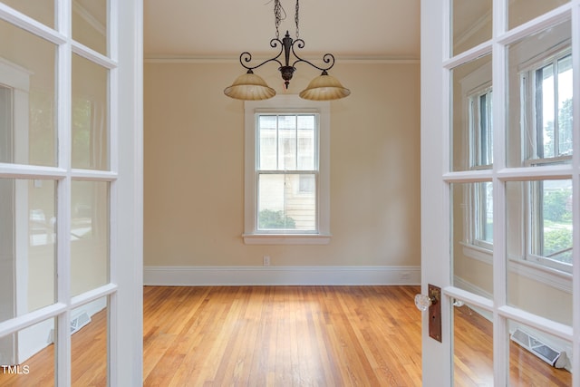 601 E Franklin St, Raleigh, NC 27604 - empty room featuring hardwood / wood-style floors and crown molding