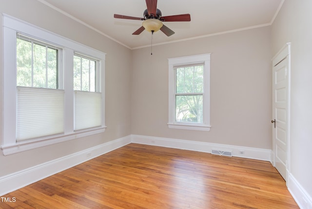 601 E Franklin St, Raleigh, NC 27604 - spare room with plenty of natural light, light wood finished floors, ceiling fan, and crown molding