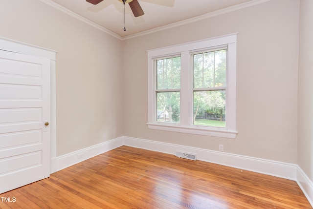601 E Franklin St, Raleigh, NC 27604 - unfurnished room featuring light wood-style floors, ceiling fan, and crown molding