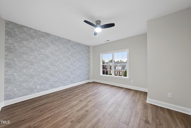 501 Ivyshaw Rd, Cary, NC 27519 - empty room with wood finished floors and a ceiling fan