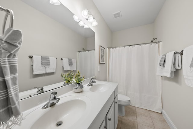 501 Ivyshaw Rd, Cary, NC 27519 - bathroom with double vanity and tile patterned flooring
