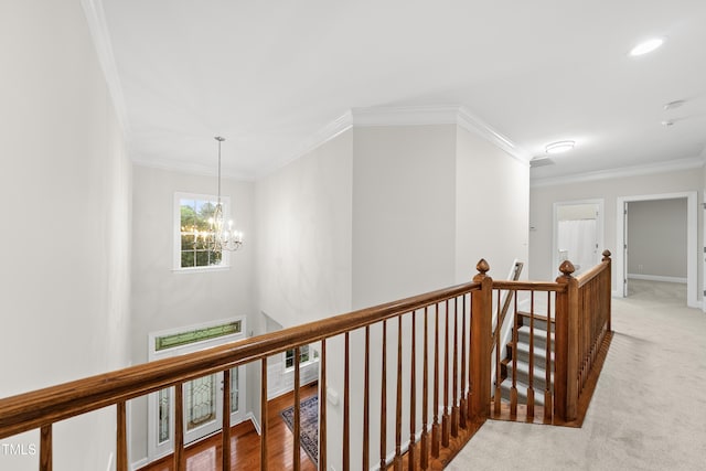 501 Ivyshaw Rd, Cary, NC 27519 - hallway with an upstairs landing, a chandelier, crown molding, carpet, and recessed lighting
