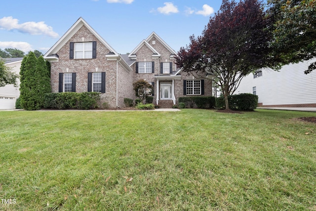 501 Ivyshaw Rd, Cary, NC 27519 - view of front of house featuring a front yard and brick siding