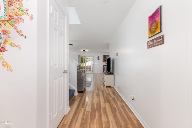 128 Palmdale Ct, Holly Springs, NC 27540 - hall featuring light wood-style floors and stairs