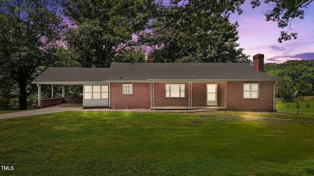 2291 Gentry Ridge Rd, Roxboro, NC 27574 - ranch-style house featuring a chimney, an attached carport, a front lawn, and driveway