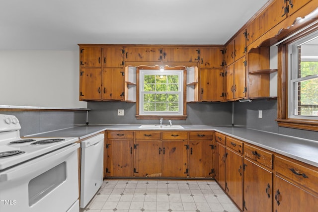 2291 Gentry Ridge Rd, Roxboro, NC 27574 - kitchen with white appliances, open shelves, and brown cabinets