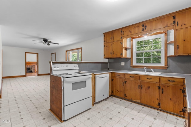 2291 Gentry Ridge Rd, Roxboro, NC 27574 - kitchen featuring white appliances, ceiling fan, a peninsula, light countertops, and brown cabinetry
