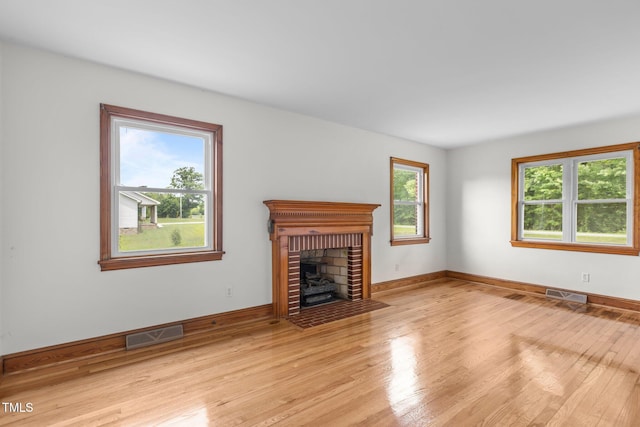 2291 Gentry Ridge Rd, Roxboro, NC 27574 - unfurnished living room featuring light wood-type flooring and a fireplace
