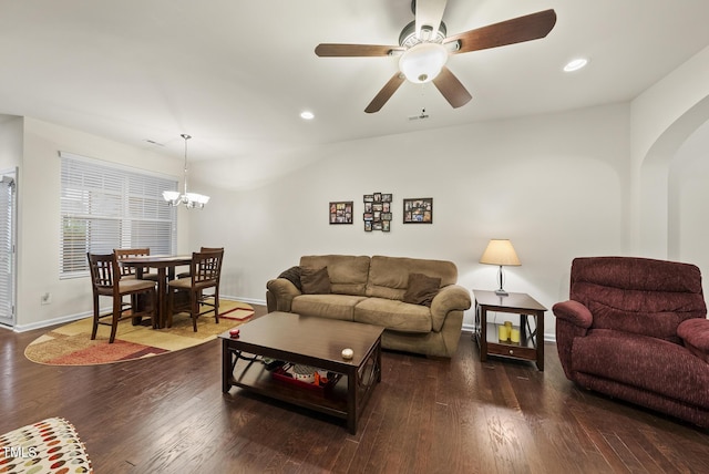 7235 Terregles Dr, Raleigh, NC 27617 - living room with arched walkways, wood finished floors, a ceiling fan, a chandelier, and recessed lighting